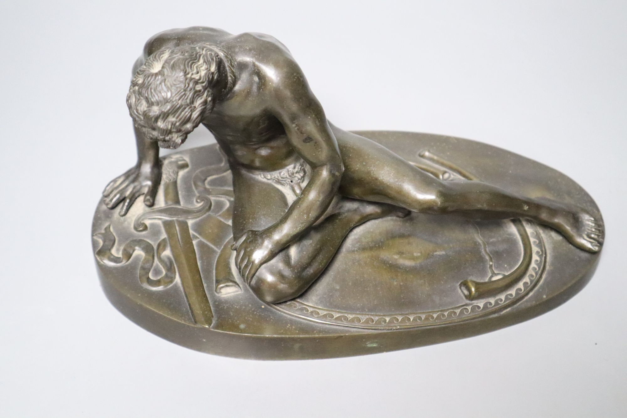 After the Antique. A 19th century bronze figure of the Dying Gaul, length 28cm